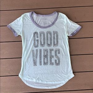 A “Good Vibes” t-shirt